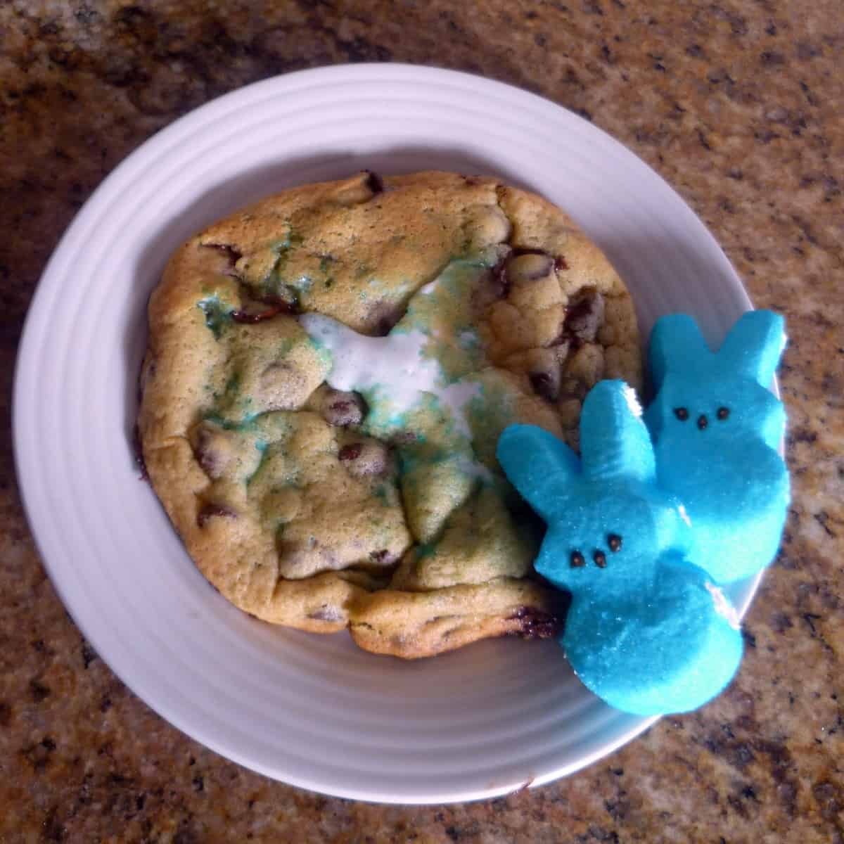 a picture of a marshmallow chocolate chip cookie filled with a peeps marshmallow