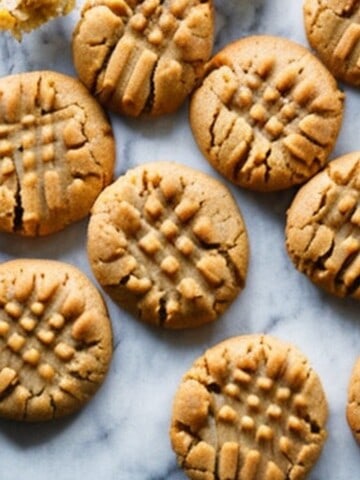 gooey pudding peanut butter cookies with a criss cross pattern