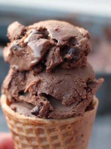 a photo of an ice cream cone with 3 ingredient blender chocolate ice cream and topped with chocolate chips