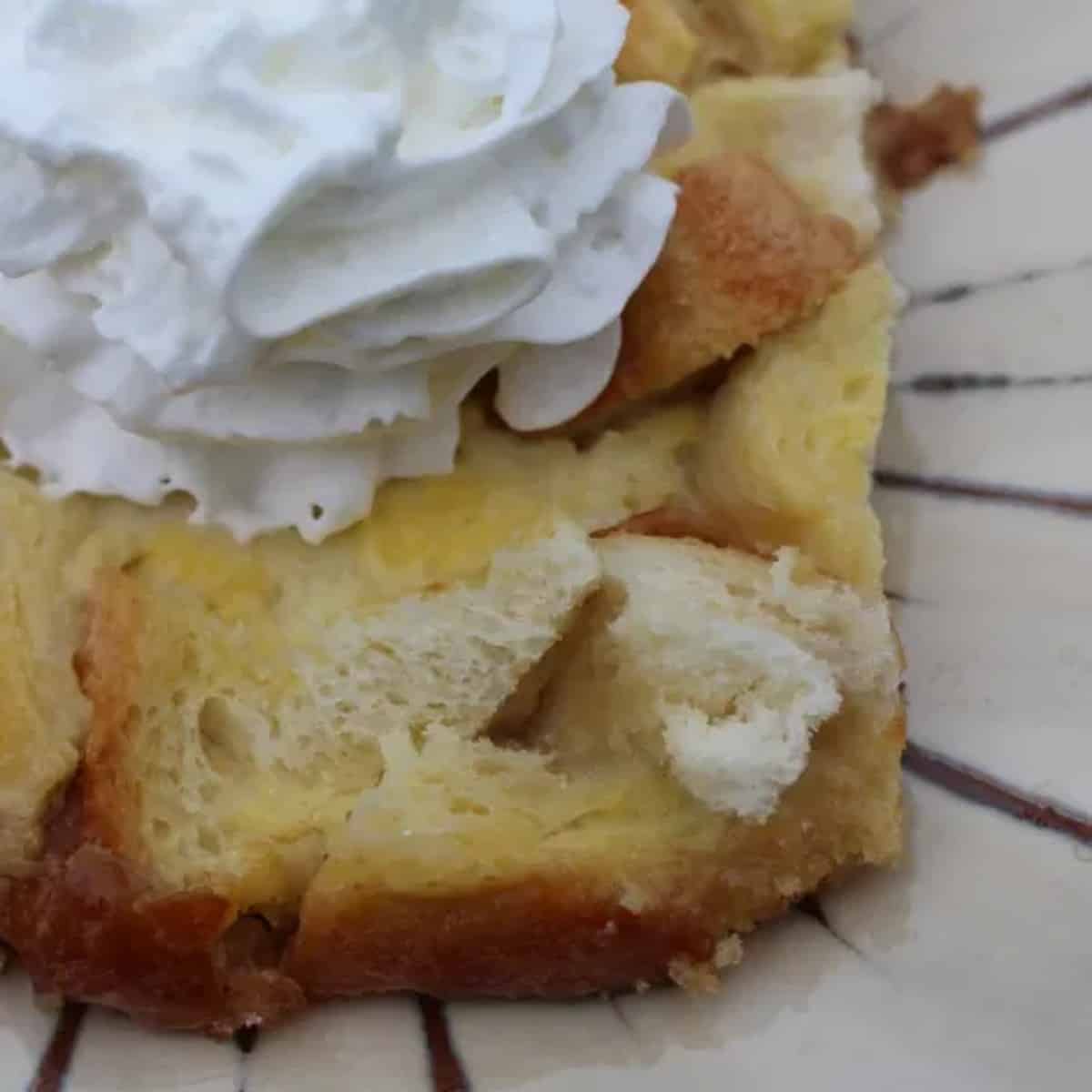 creme brulee french toast topped with whipped cream
