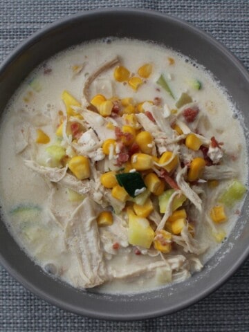 A close-up photo of Panera Corn Chowder, showcasing its fresh ingredients and creamy texture