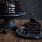A romantic black velvet cake recipe adorned with berries for Valentine's Day