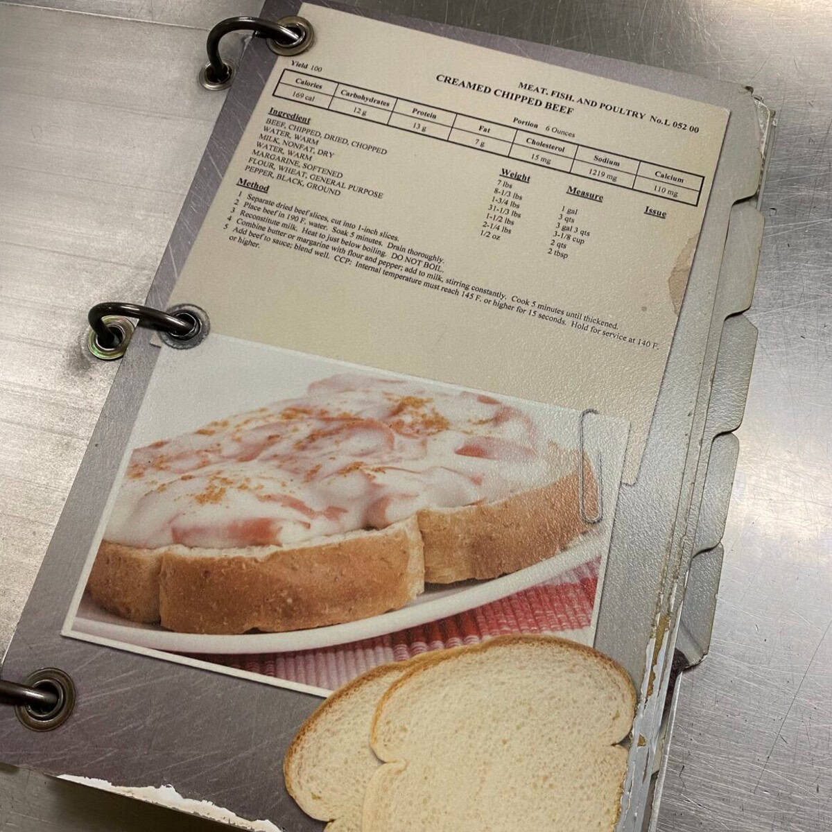 a recipe for "CREAMED CHIPPED BEEF" on the cover. The nutritional information for the recipe is listed at the top. Ingredients are listed on the left and instructions are listed on the right.