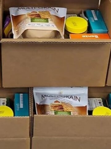 a picture of a brown mailing box filled with free groceries that are gluten free. These care packages are sent by the gluten intolerance group