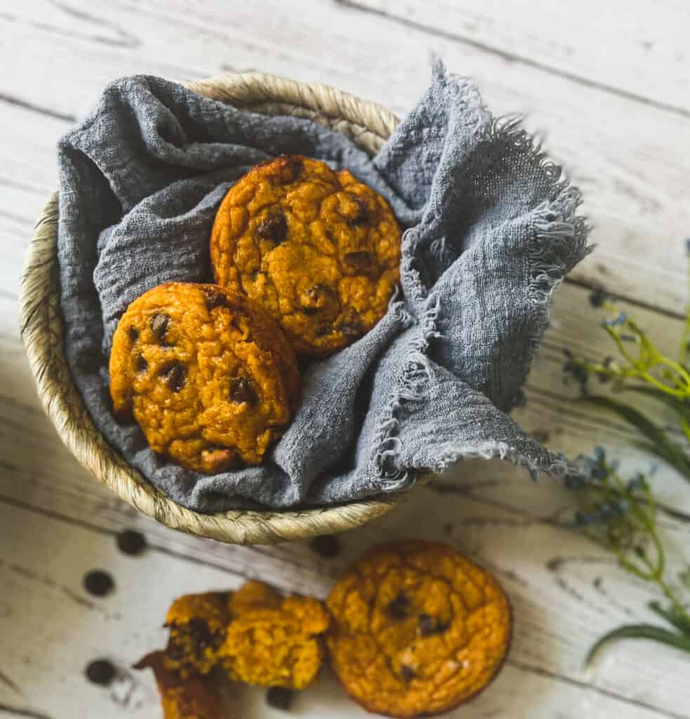 5 ingredient protein muffins in a basket with blue napkin