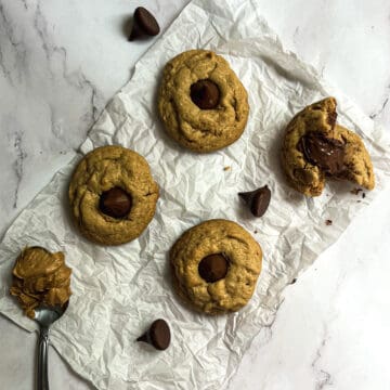 Peanut butter blossom cookies are a classic holiday cookie that are made with peanut butter, sugar, flour, baking soda, salt, and chocolate kisses. The cookies are baked until they are just golden brown, and then a chocolate kiss is pressed into the center of each cookie. The cookies are soft and chewy, and the chocolate kisses add a delicious chocolatey flavor.