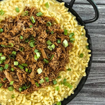 Pulled pork mac and cheese A delicious and cheesy dish made with macaroni pasta, pulled pork, and cheese sauce A perfect comfort food for a cold day A popular dish at potlucks and barbecues
