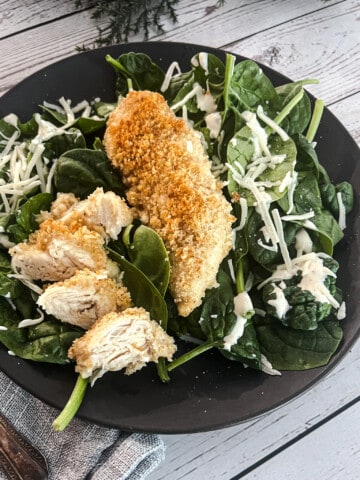 chicken caesar florentine with chicken, crushed caesar croutons, and parmesan cheese.