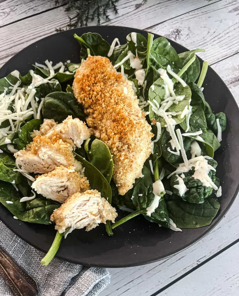 chicken caesar florentine with chicken, crushed caesar croutons, and parmesan cheese. 