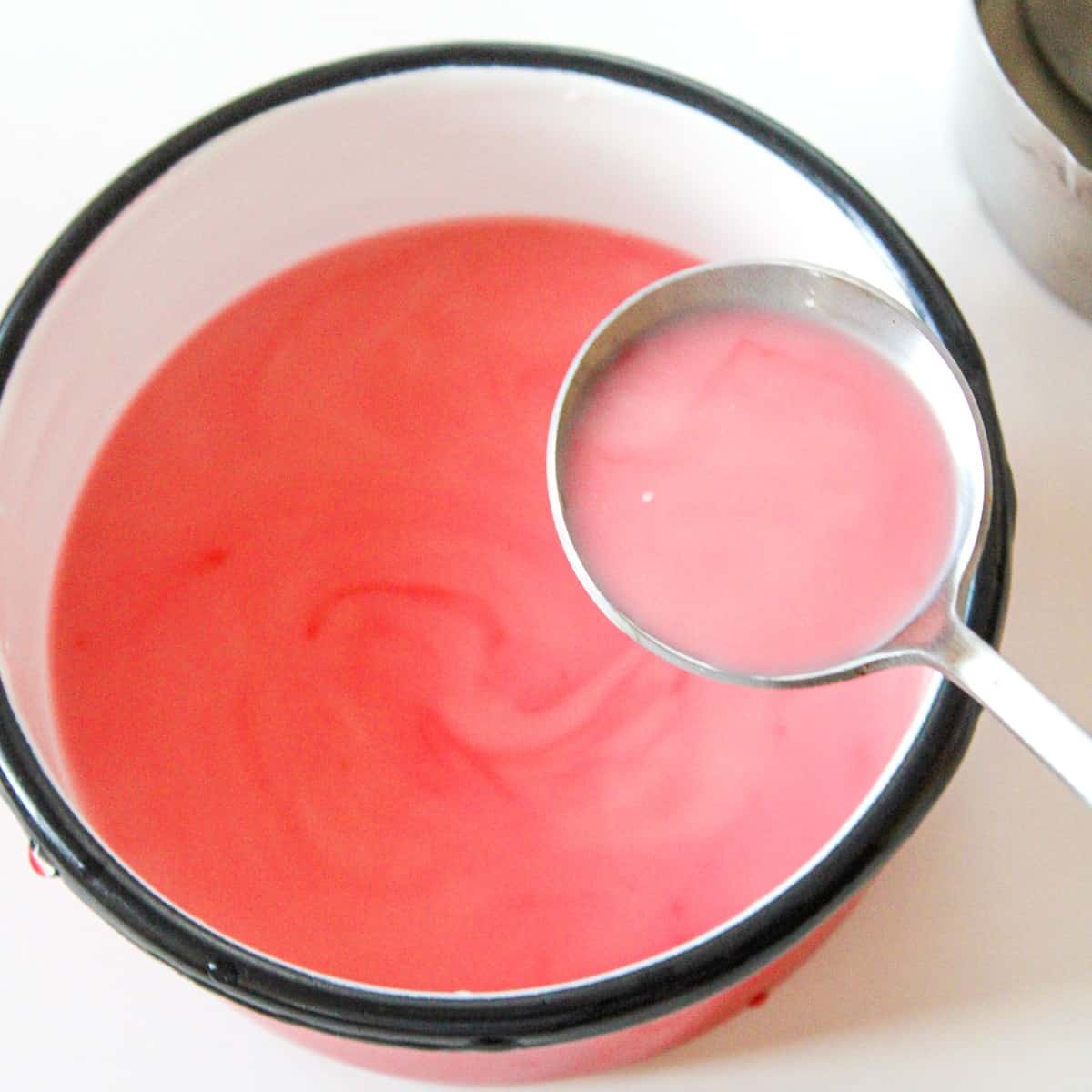 Add your dye to your red velvet cocoa, then stir until smooth.