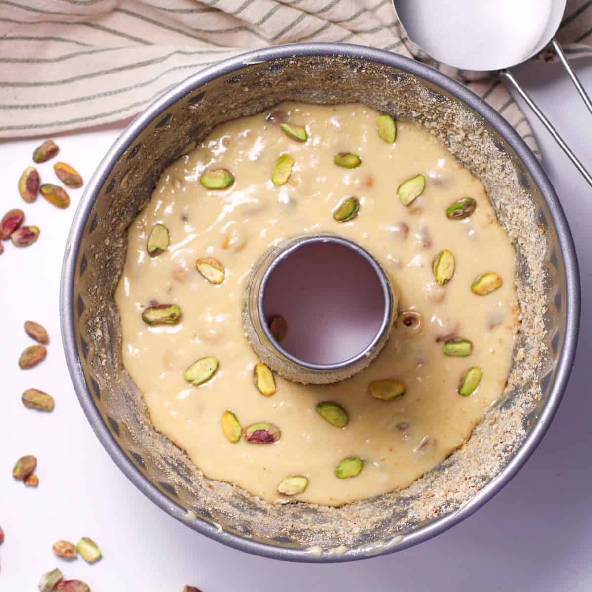 Pour pistachio cake ingedients into a bundt pan