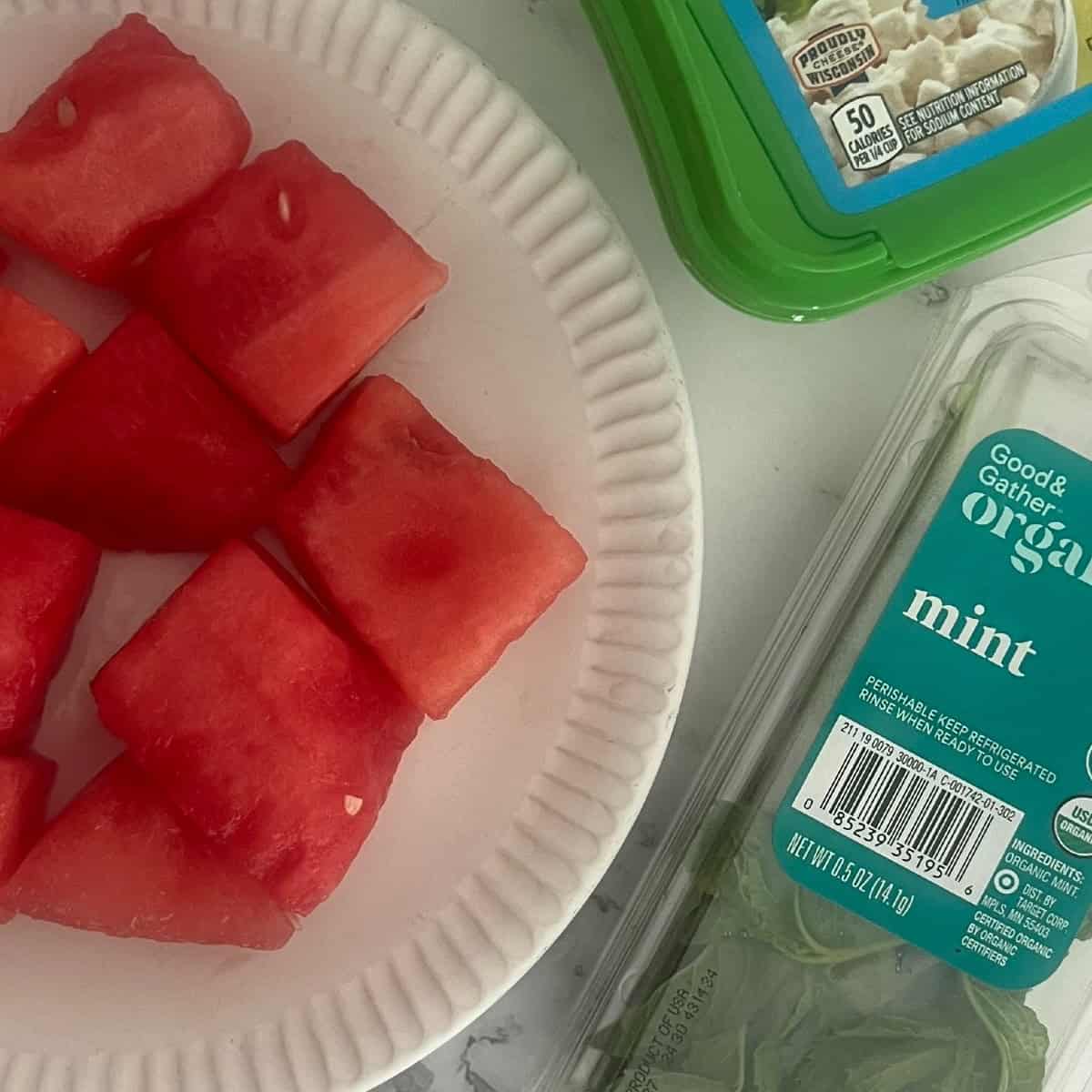 ingredients needed for watermelon salad include watermelon, goat cheese and mint leaves