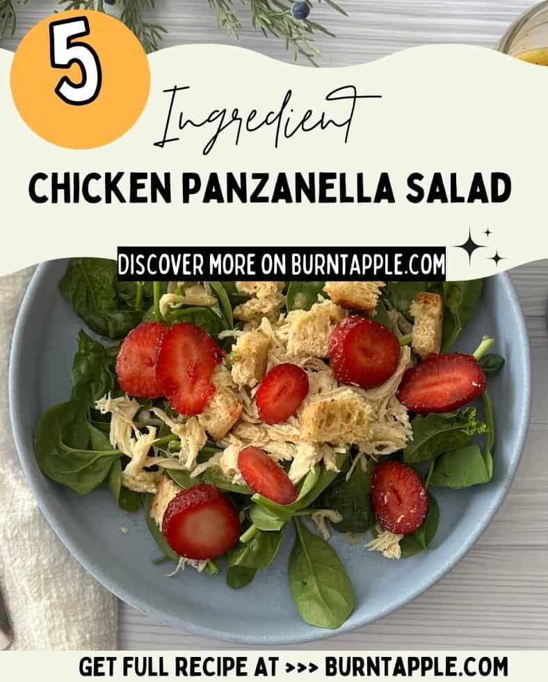 A bowl of salad with grilled or roasted chicken breast slices, fresh strawberries, and croutons on a table. The salad greens appear to be mixed greens with a romaine lettuce base. Text overlay on the image says "5 Ingredient Chicken Panzanella Salad" and "Discover More on Burntapple.com".