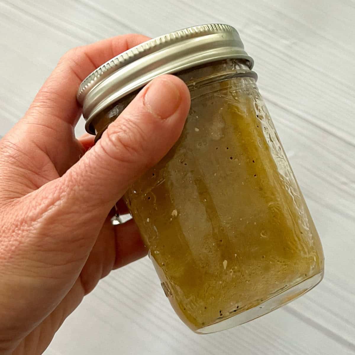 shake cider vinaigrette in mason jar