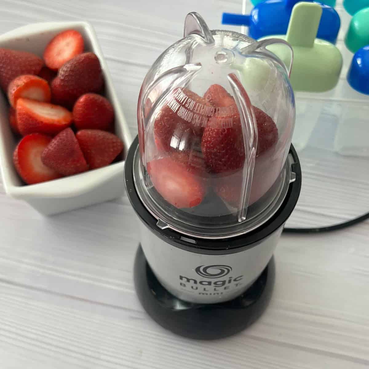 place strawberries in blender