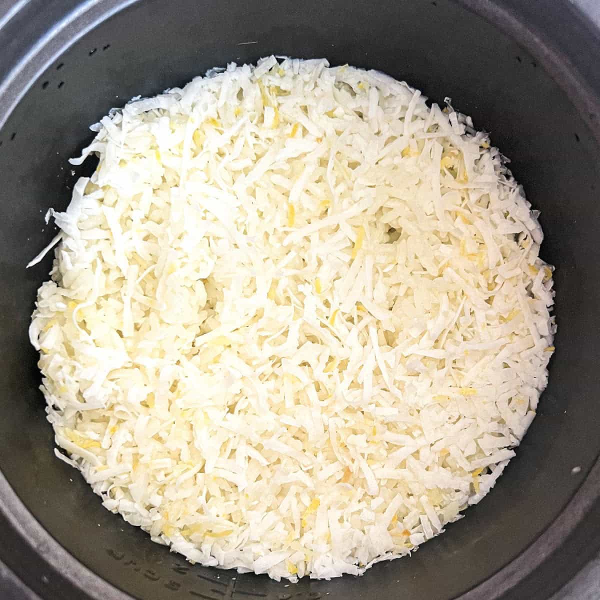 Cook, then serve your coconut rice in rice cooker recipe