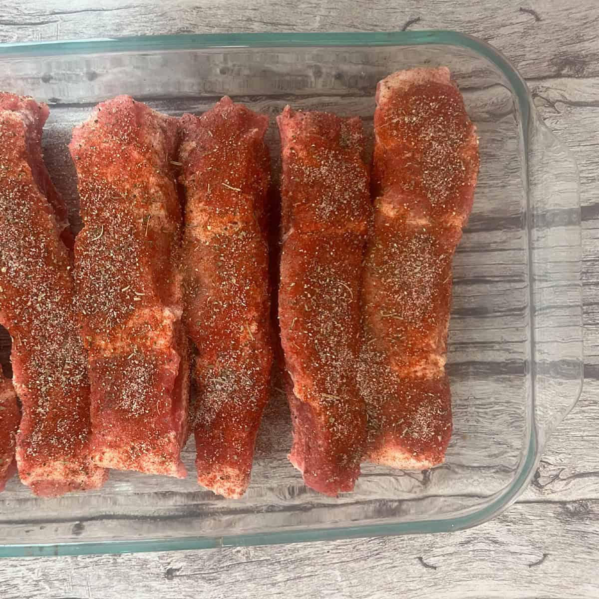 a photo of seasoned ribs with paprika, smoked flavoring, salt and pepper and thyme