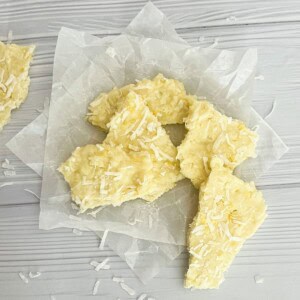 This image appears to be of lemon coconut bark. It's a light-colored, flaky treat with a white base and bits of coconut throughout.